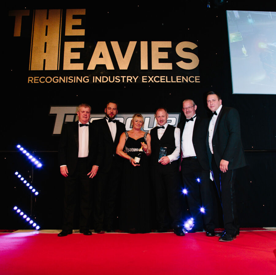 A winning team collecting their award