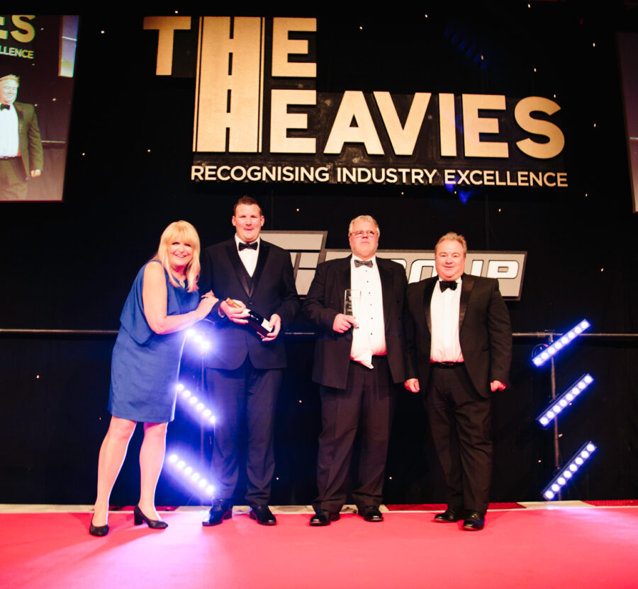 A winning team celebrating on stage